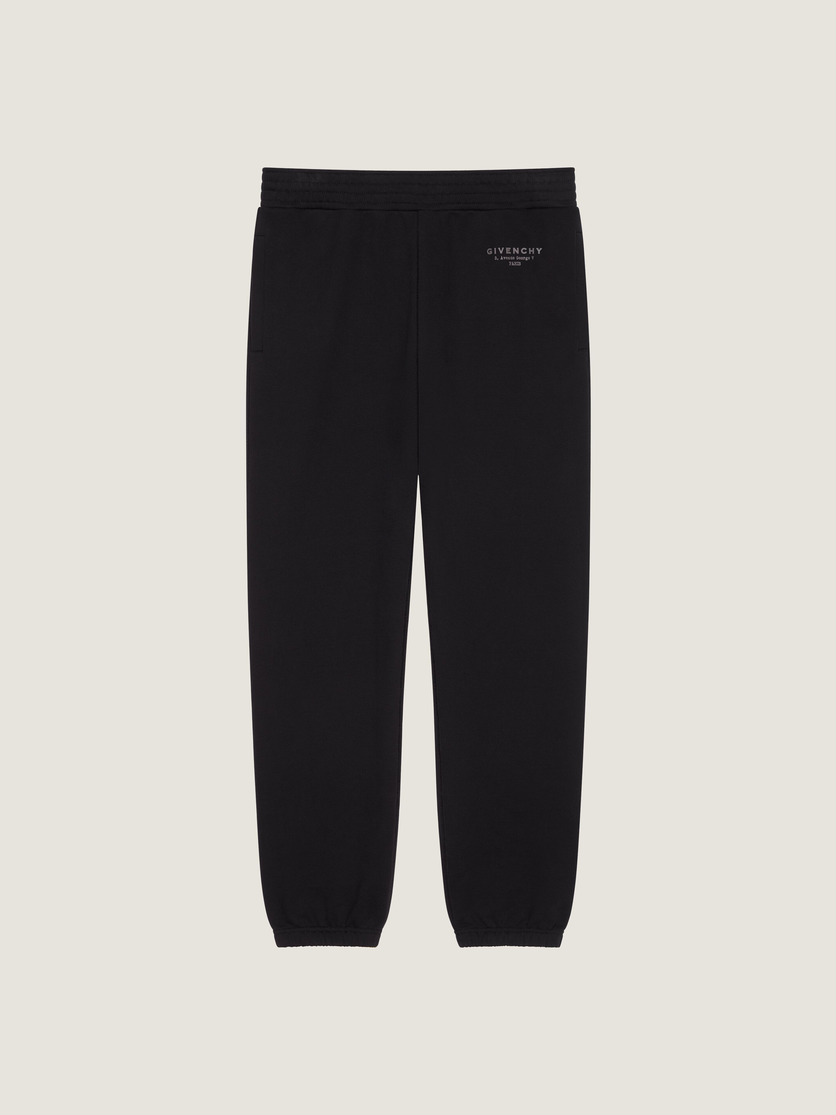 Joggers in fleece with GIVENCHY Stamp print